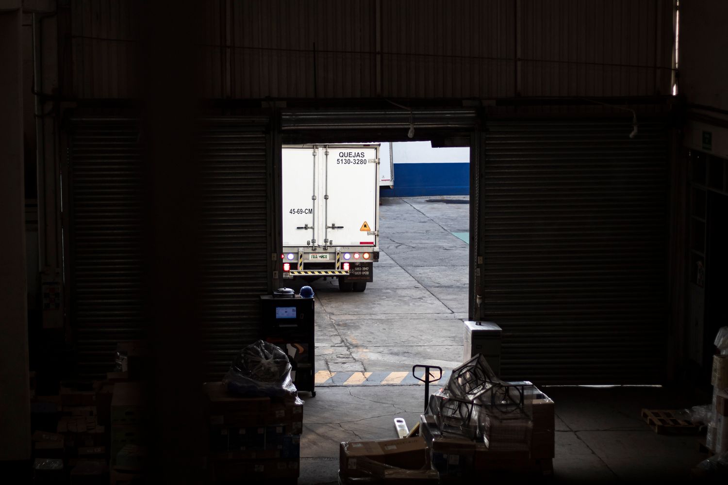 Freight truck at a loading facility representing hot tub delivery planning